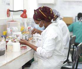 A technician works on a culture in the the CSref bacteriology laboratory in Koutiala, Mali.