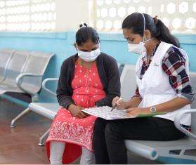 An MSF staff member in India talks to a patient who was part of the EndTB clinical trial to find better treatments for tuberculosis.