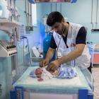 An MSF doctor checks on a child patient at the NICU MSF supports at Mazar-i-Sharif Regional Hospital in Afghanistan.