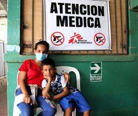 Yamilex, a migrant in Tumbes, Peru, with her son.