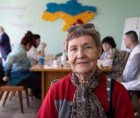 A mental health patient smiles in a support center for displaced persons in Ukraine. 