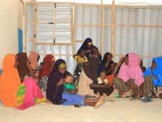 Mothers and children in a medical outreach center in Baidoa, Somalia. 