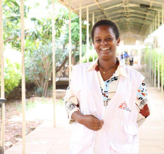 Health promotion officer Teka in front of Abiy Adi Hospital in Ethiopia. 