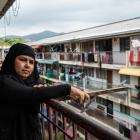 A Rohingya woman on a balcony in Penang, Malaysia.