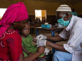 Child getting a measles vaccination in Timbuktu